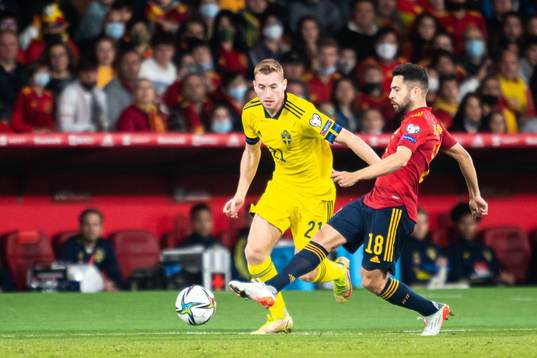 Dejan Kulusevski of Sweden and Jordi Alba of Spain