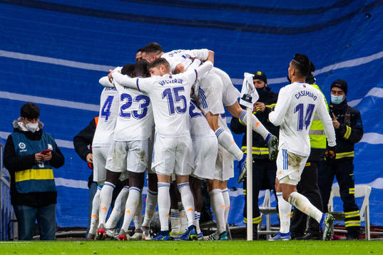 Players of Real Madrid celebrate after Vinicius Junior (not pictured) scored 2-1