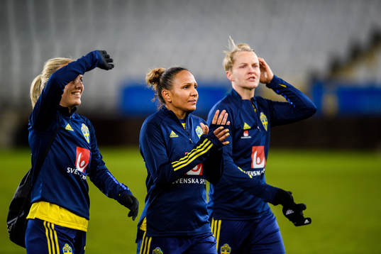 Mimmi Larsson , Madelen Janogy and Nilla Fischer of Sweden celebrate