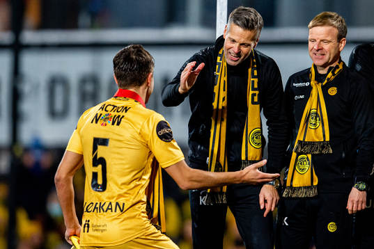Kjetil Knutsen, head coach of Bodø/Glimt, celebrates winning the league with Fredrik André Bjørkan and assistant coach Morten Kalvenes