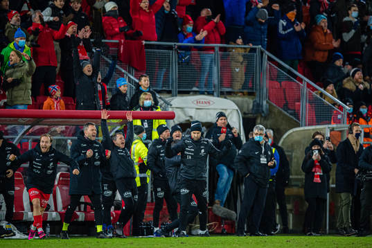 Petter Dahle Strand, Håkon Eikemo Opdal of Brann and Eirik Horneland, head coach of Brann, celebrates at the final whistle