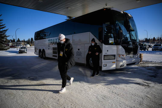 Goaltender Jesper Wallstedt of Sweden walks off the team bus