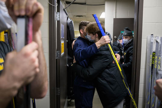 Doctor Ryan Allenby and Daniel Ljungman of Sweden hug each