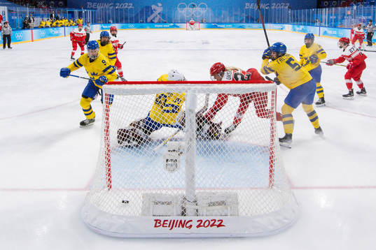 Julie Oksbjerg of Denmark scores 1-1 behind goaltender Emma