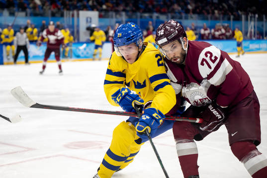 Lucas Wallmark of Sweden and Janis Jaks of Latvia in an ice