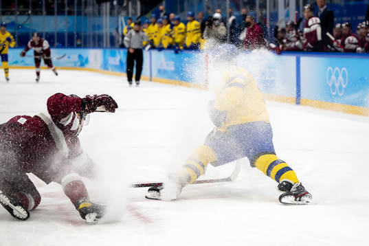 Janis Jaks of Latvia and Max Friberg of Sweden in an ice