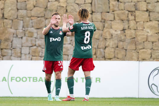 Maciej Rybus and Alexis Beka Beka of Lokomotiv Moscow celebrate the 2-5 goal