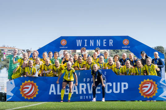 Players of Sweden celebrate with the trophy