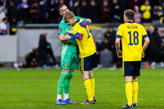 Filip Helander and goalkeeper Robin Olsen of Sweden celebrate