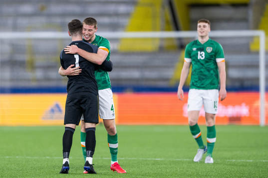 goalkeeper Brian Maher and Mark McGuinness of Ireland celebrate