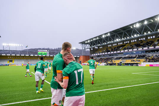 Mark McGuinness celebrates with Ross Tierney of Ireland who scored 0-1