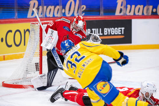 Lucas Wallmark of Sweden against Goalkeeper Reto Berra of