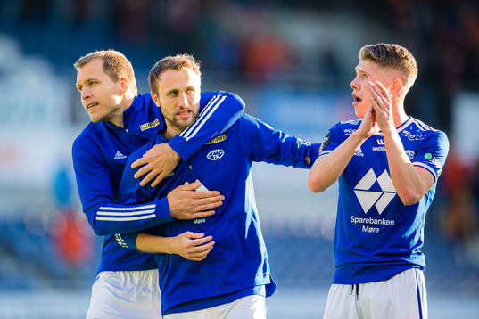 Martin Bjørnbak, Magnus Wolff Eikrem and Markus André Kaasa of Molde celebrates