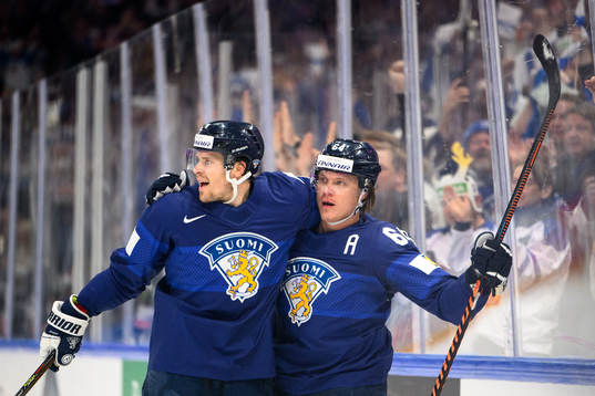 Mikko Lehtonen and Mikael Granlund of Finland celebrate