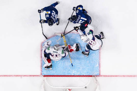 Harri Pesonen and Valtteri Filppula of Finland sees Mikko