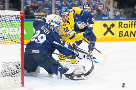 Goaltender harri Säteri of Finland and Max Friberg of