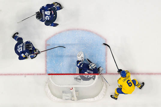 Adam Larsson of Sweden scores the 0-1 goal behind