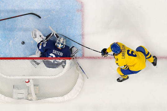Adam Larsson of Sweden scores the 0-1 goal behind