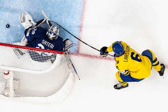Adam Larsson of Sweden scores the 0-1 goal behind