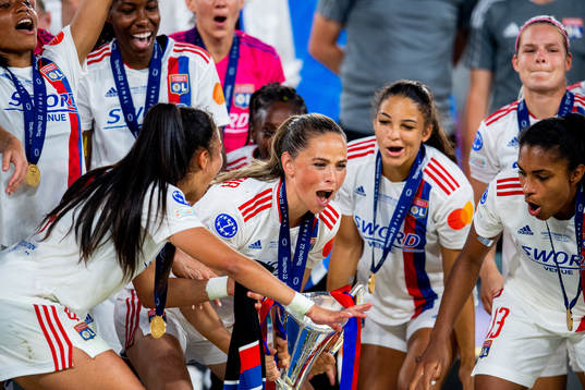 Sara Björk Gunnarsdóttir of Lyon lifts the winners trophy