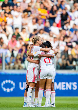 Ada Hegerberg of Lyon celebrates with teammates after scoring 0-2