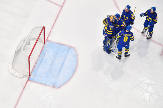 Goaltender Magnus Hellberg of Sweden celebrate with