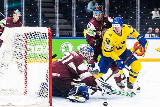 of Latvia goaltender Arturs Silovs and Kristaps Sotnieks