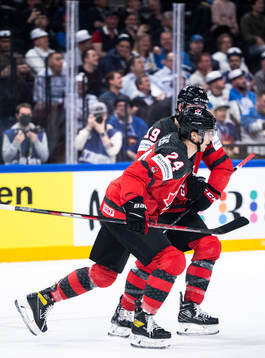 Dylan Cozens of Canada celebrates