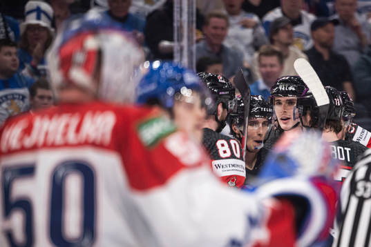 Dylan Cozens of Canada celebrate with teammates