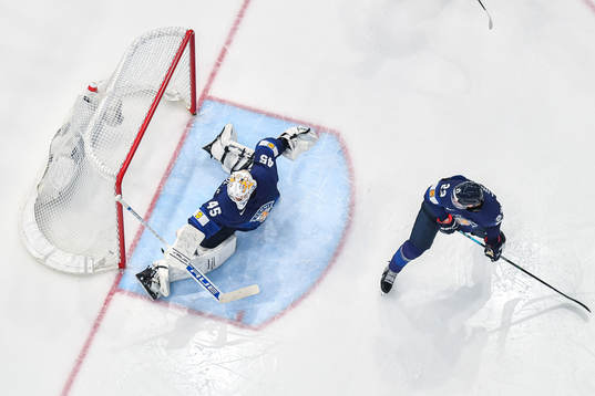 Goaltender Juho Olkinuora of Finland when Dylan Cozens of