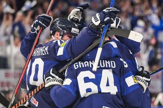 Mikael Granlund of Finland celebrates with team mates