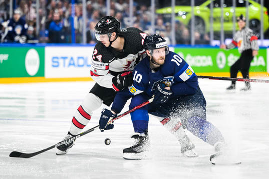 Dylan Cozens of Canada and Joel Armia of Finland