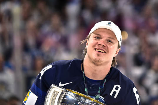 Mikael Granlund of Finland celebrate with the trophy