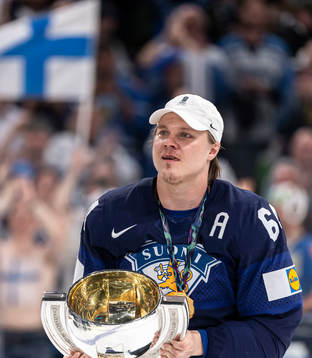 Mikael Granlund of Finland celebrates with the trophy