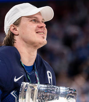 Mikael Granlund of Finland celebrates with the trophy
