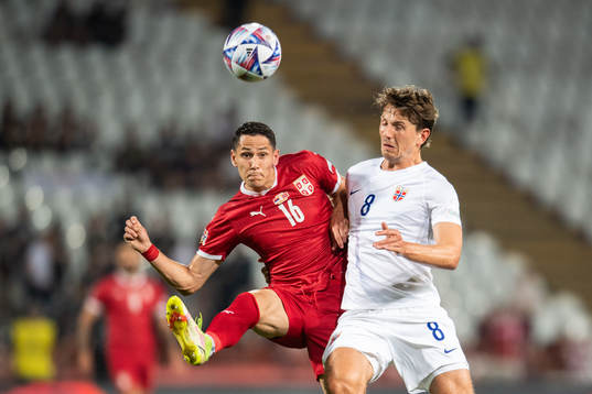 Sasa Lukić of Serbia and Sander Berge of Norway
