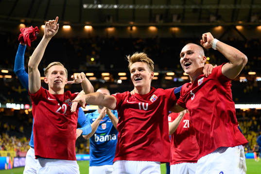 Marcus Holmgren Pedersen, Martin Ødegaard and Leo Skiri Østigård of Norway celebrates
