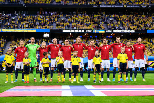 The players of Norway at lineup ahead of the Nations League football match between Sweden and Norway on June 5, 2022 in Stockholm. From left: Martin Ødegaard, goalkeeper Ørjan Håskjold Nyland, Birger Meling, Morten Thorsby, Leo Skiri Østigård, Sander Berge, Marcus Holmgren Pedersen, Stefan Strandberg, Alexander Sørloth, Mohamed Elyounoussi and Erling Braut Haaland. 
