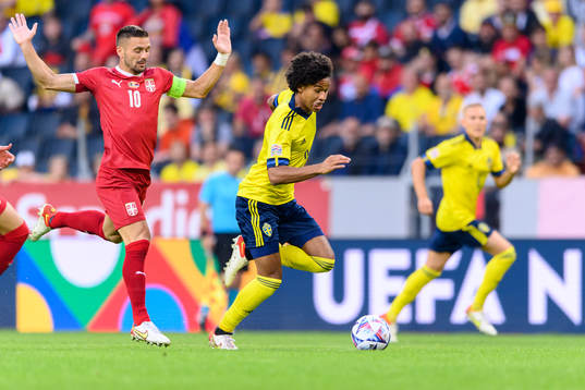 Dusan Tadic of Serbia and Jens Cajuste of Sweden
