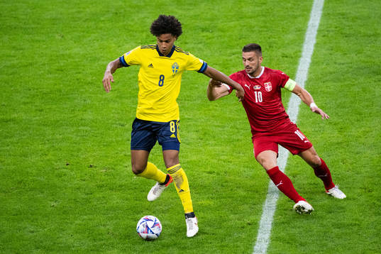 Jens Cajuste of Sweden and Dusan Tadic of Serbia