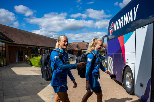 Guro Bergsvand and goalkeeper Sunniva Skoglund of the Norwegian national football team walk to the players bus ahead of the UEFA Women's Euro 2022 Championship on July 5, 2022 in Brighton.