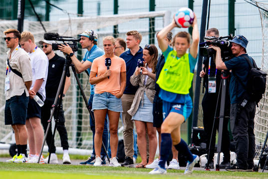 Solveig Gulbrandsen of TV 2 and media attend a training session with the Norwegian national football team ahead of the UEFA Women's Euro 2022 Championship on July 5, 2022 in Brighton.