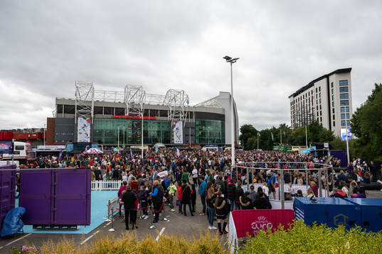 Spectators outside Old Trafford ahead of the UEFA Women's Euro 2022 group stage match between England and Austria on July 6, 2022 in Manchester. 