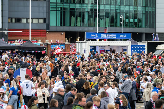  Spectators outside Old Trafford ahead of the UEFA Women's Euro 2022 group stage match between England and Austria on July 6, 2022 in Manchester. 
