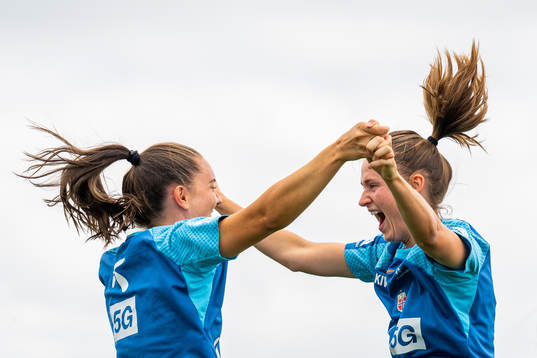 Vilde Bøe Risa and Caroline Graham Hansen of the Norwegian national football team celebrate at a training session