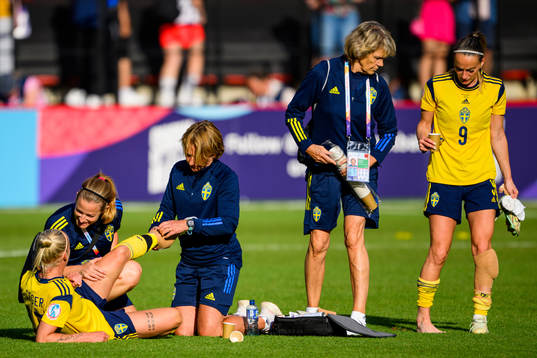 Caroline Seger and Kosovare Asllani of Sweden gets treatment