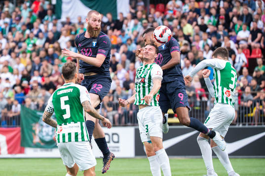 Jo Inge Berget and Isaac Kiese Thelin  of Malmö FF and Nicolás Gorobsov and Mario Pavelic of FK Zalgiris