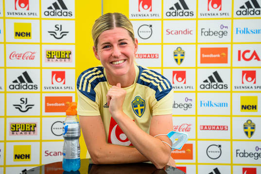 Olivia Schough of the Swedish women's national football team is interviewed by the media at a press event