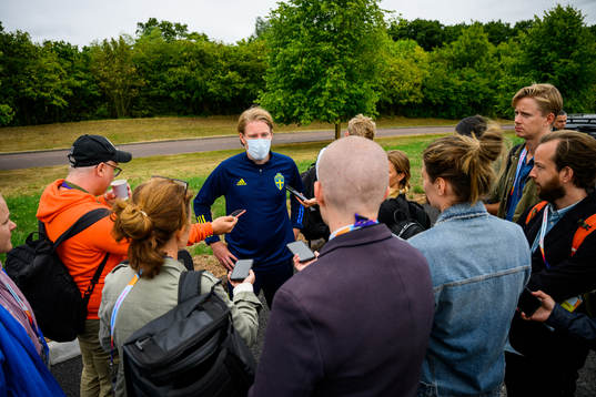 Fredrik Madestam, press officer of the Swedish women's national football team is interviewed by the media at a training session