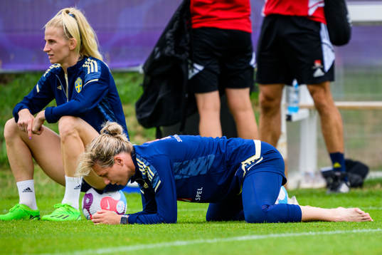Sofia Jakobsson and goalkeeper Jennifer Falk of the Swedish women's national football team at a training session